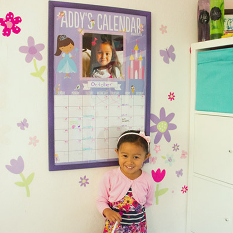 girl with dry-erase poster calendar